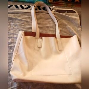 Minimalist cream colored leather purse.